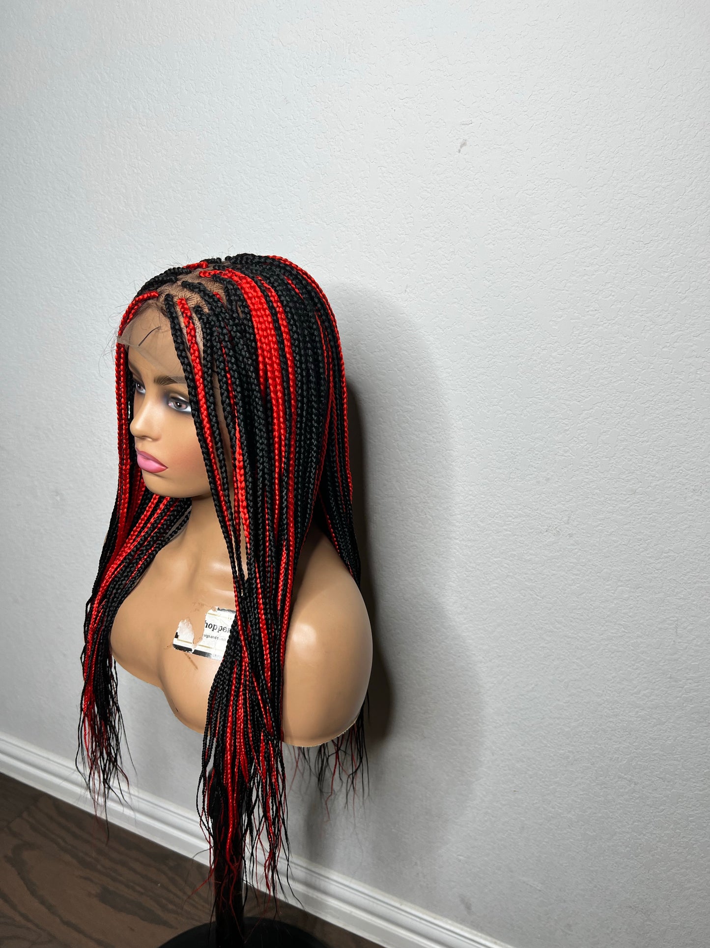 Box braids with red highlights