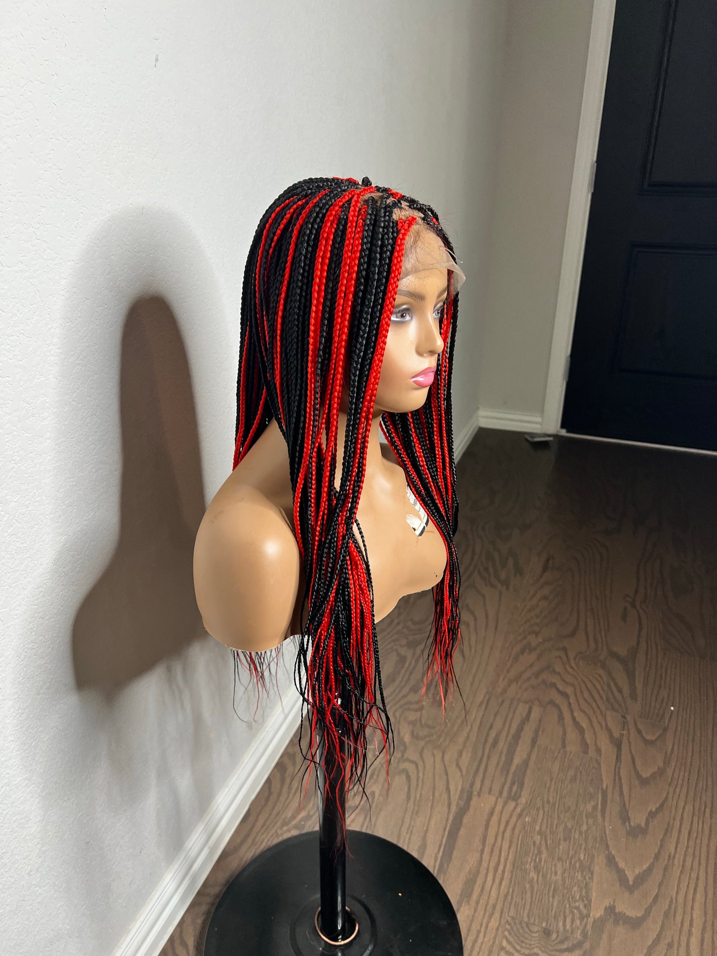 Box braids with red highlights