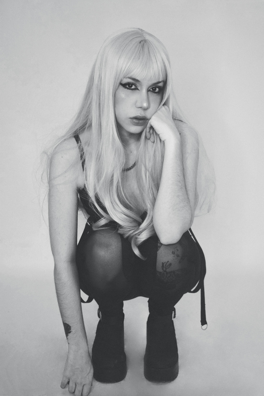 A black and white photo of a woman with long blonde hair