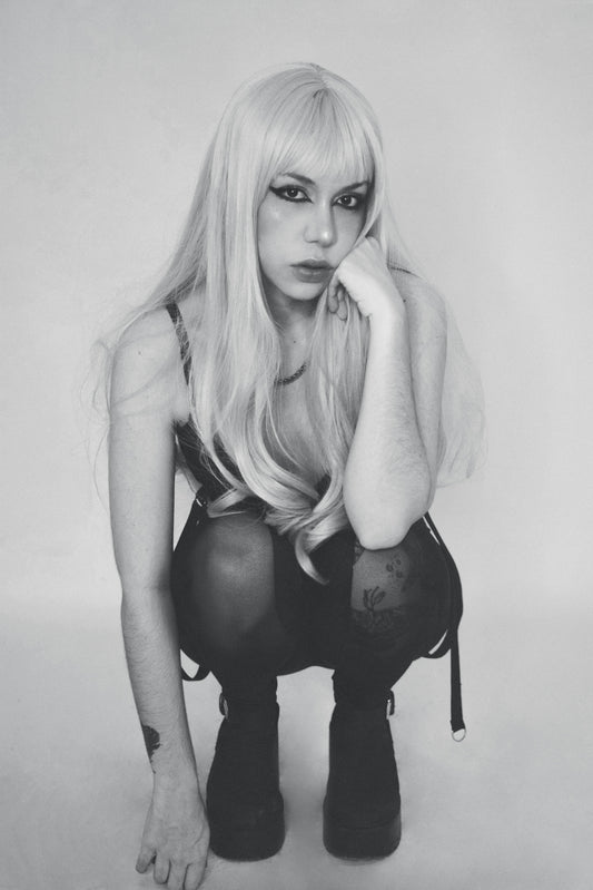 A black and white photo of a woman with long blonde hair