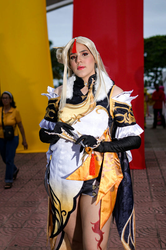 Woman in elaborate costume with blonde hair and red markings