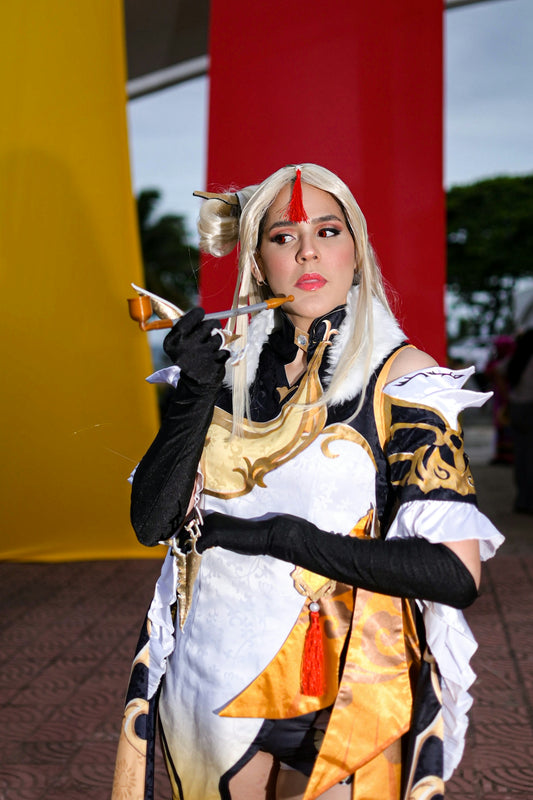 Woman in elaborate costume holding a prop