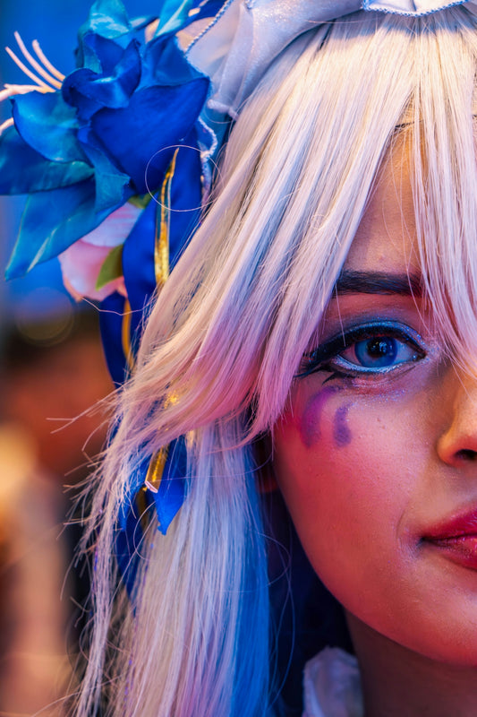Woman with white hair and blue eye makeup