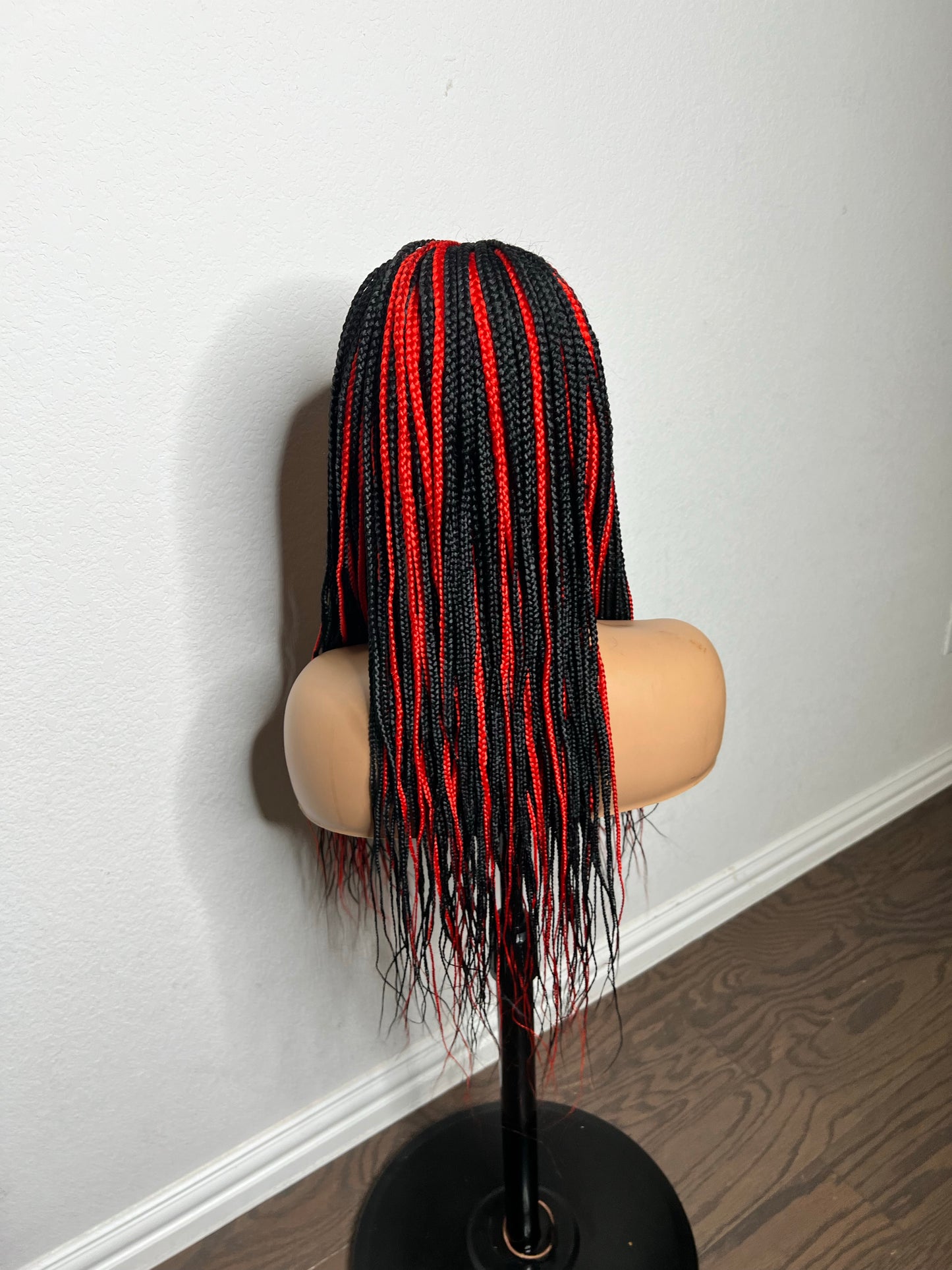 Box braids with red highlights