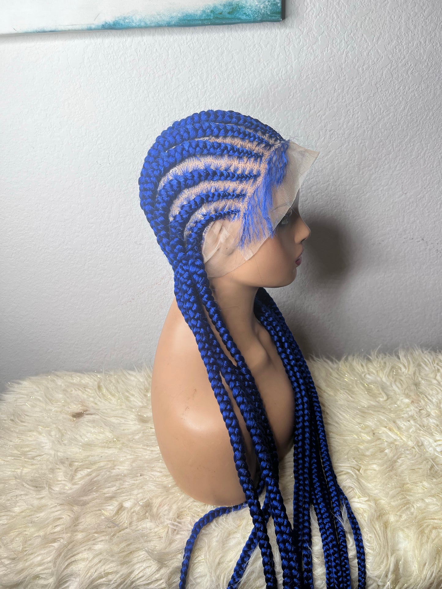 Blue stitch braids to the back