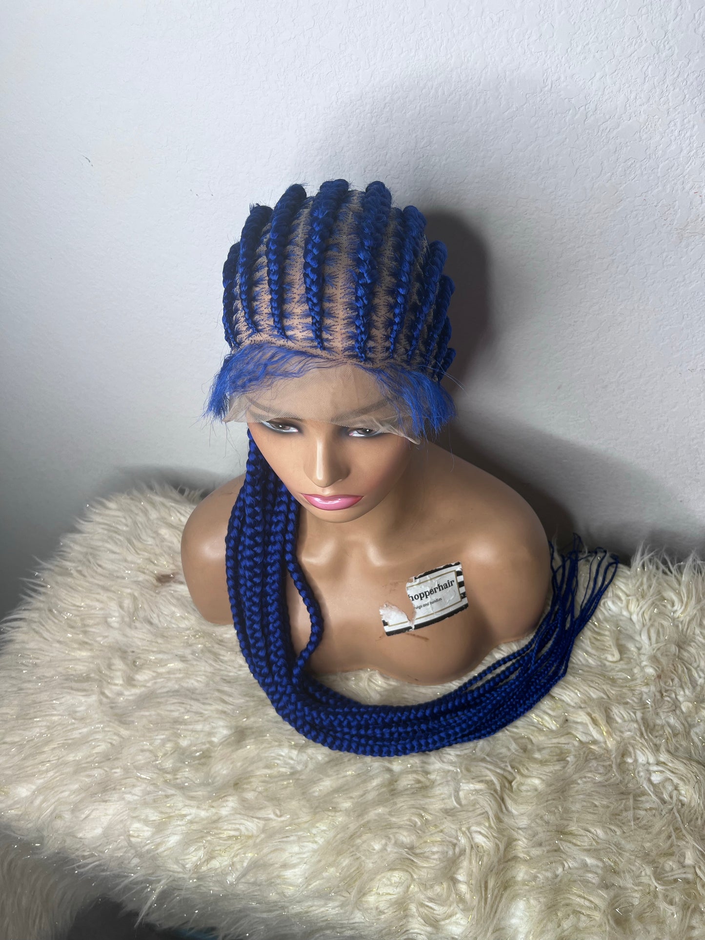 Blue stitch braids to the back