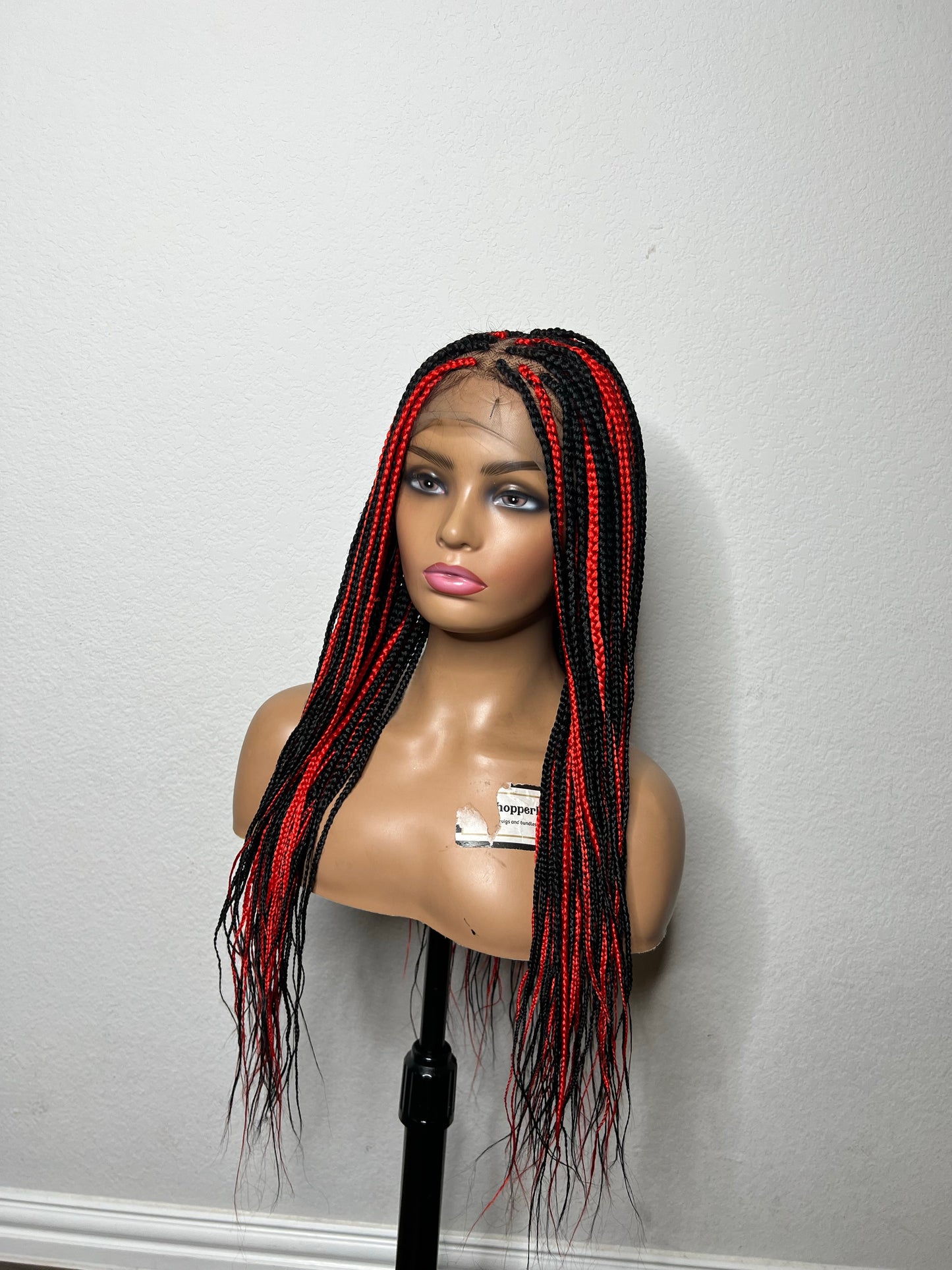 Box braids with red highlights
